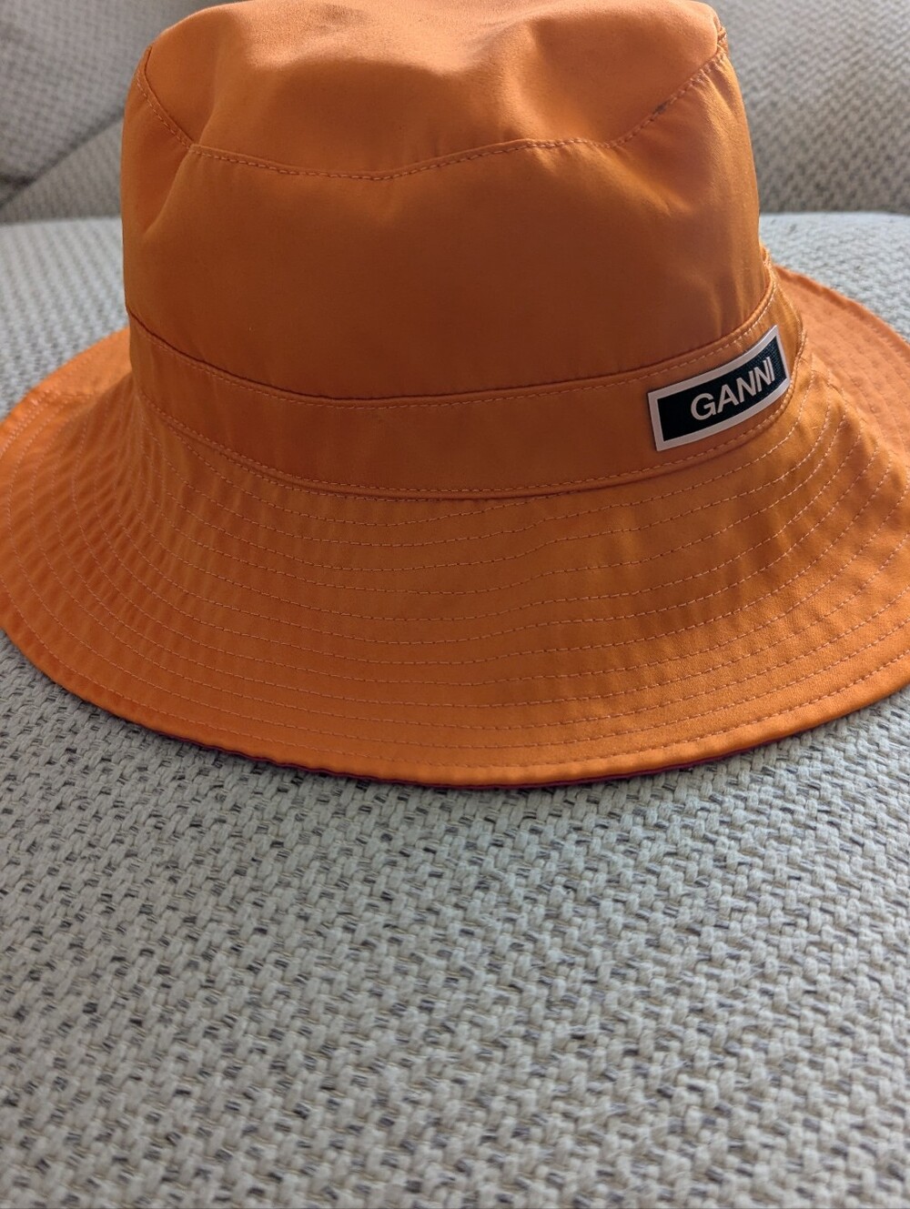 GANNI Tech Bucket Hat in Vibrant Orange & Pink